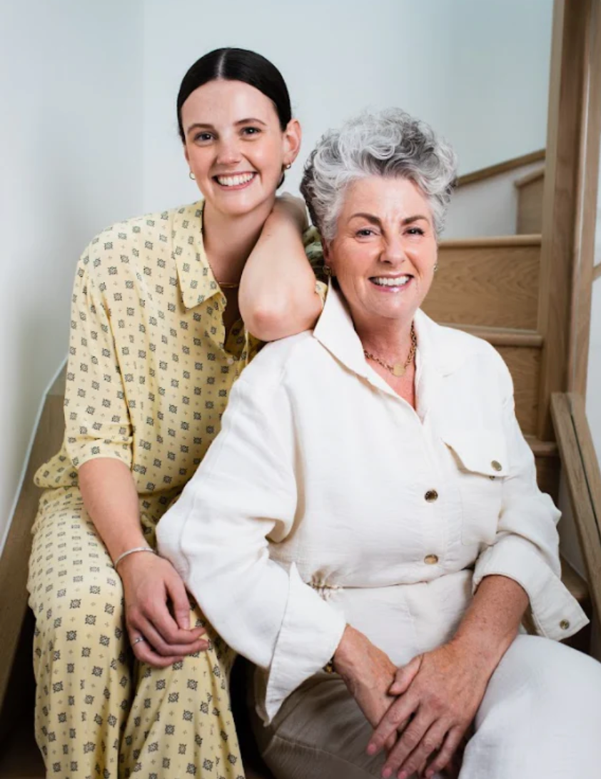 Image of Darcy Laceby and Maxine Laceby, sat on the stairs together