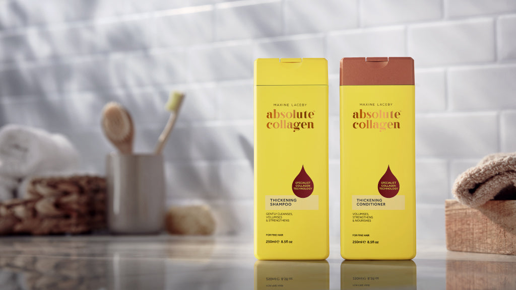 Photo showing a bottle of Absolute Collagen shampoo and Absolute Collagen conditioner standing on a shiny bathroom surface